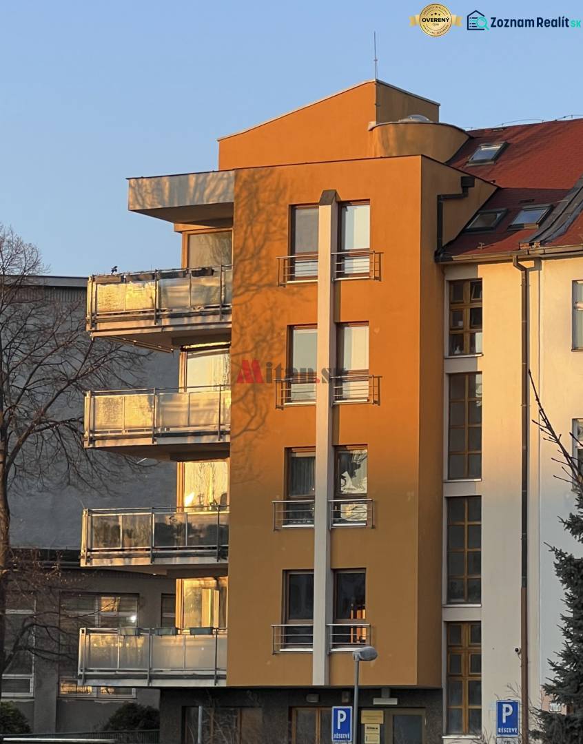 Building on Fazuľová Street in Bratislava - Old Town, with glass balconies and parking.