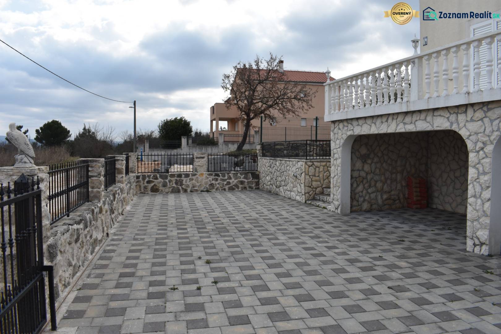 A family house in Pridraga with a stone courtyard and a view of the surrounding nature.