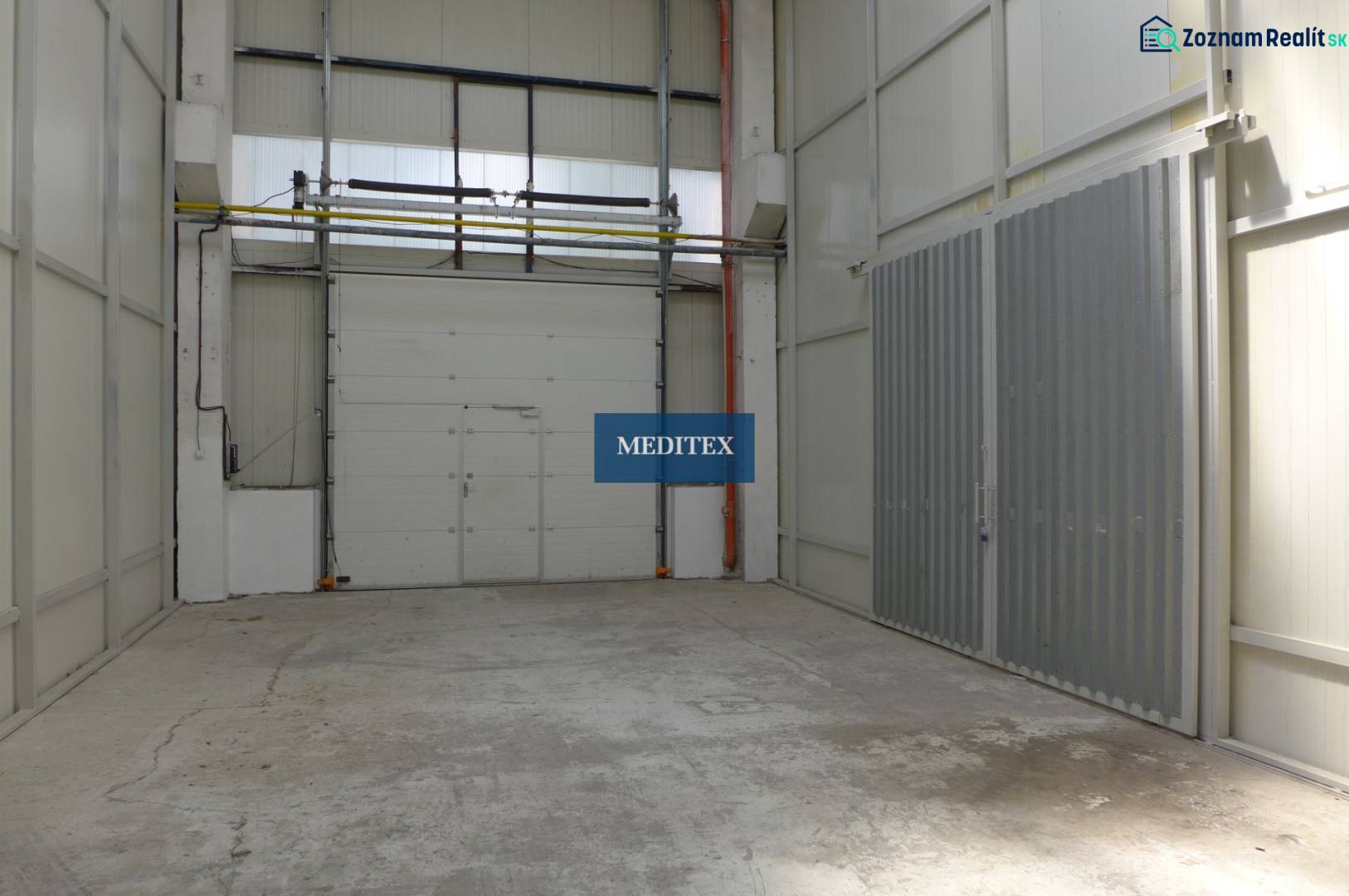 A space with concrete floors and high ceilings in warehouses and halls.