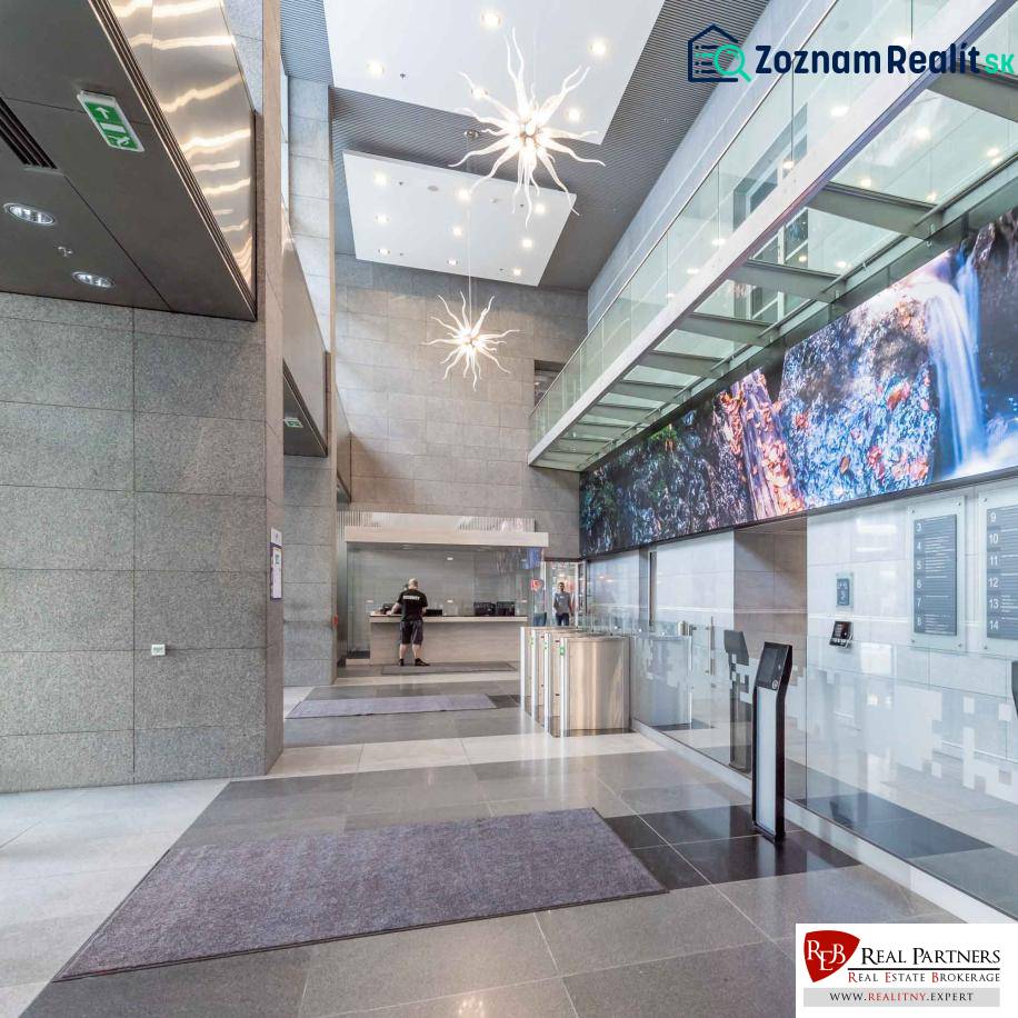 A modern entrance hall with a reception and lighting in offices.