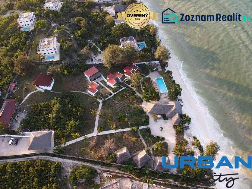 Aerial view of coastal bungalows and villas in Paje, Zanzibar South East, overlooking the ocean.