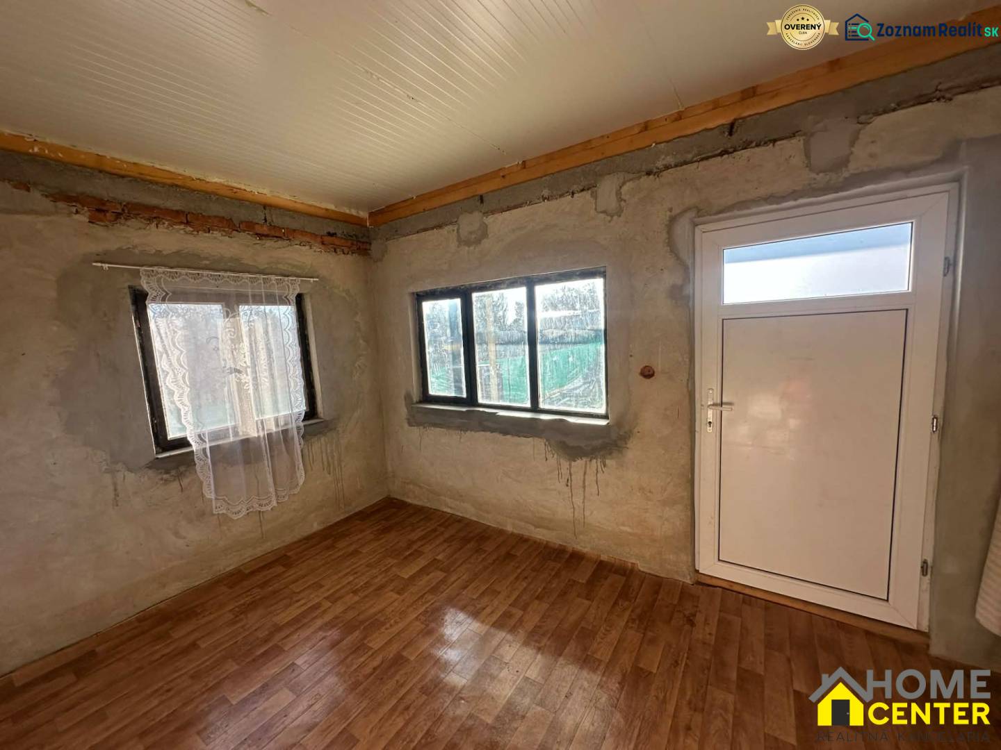 Interior with wood-patterned flooring and white doors in the Gardens section.