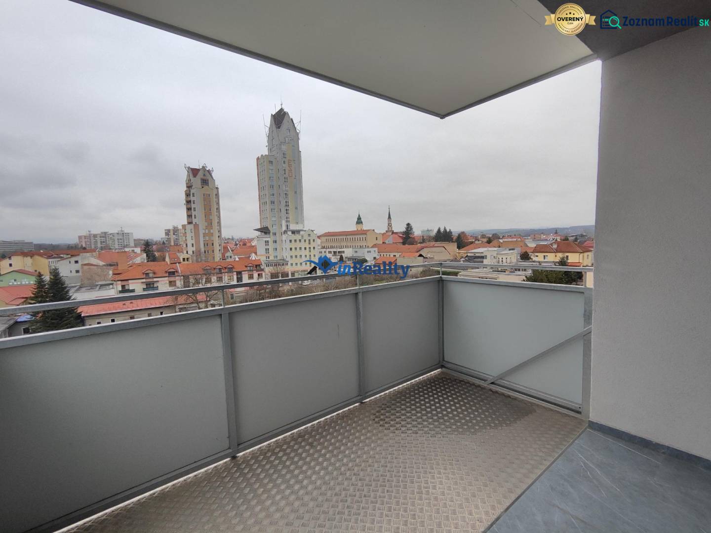 The balcony of a 2-room apartment on Majakovského Street in Lučenec with a city view.