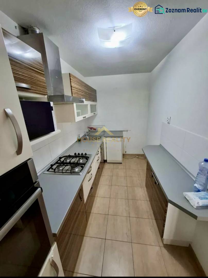 A kitchen in a 4-room apartment with a gas stove and storage space.