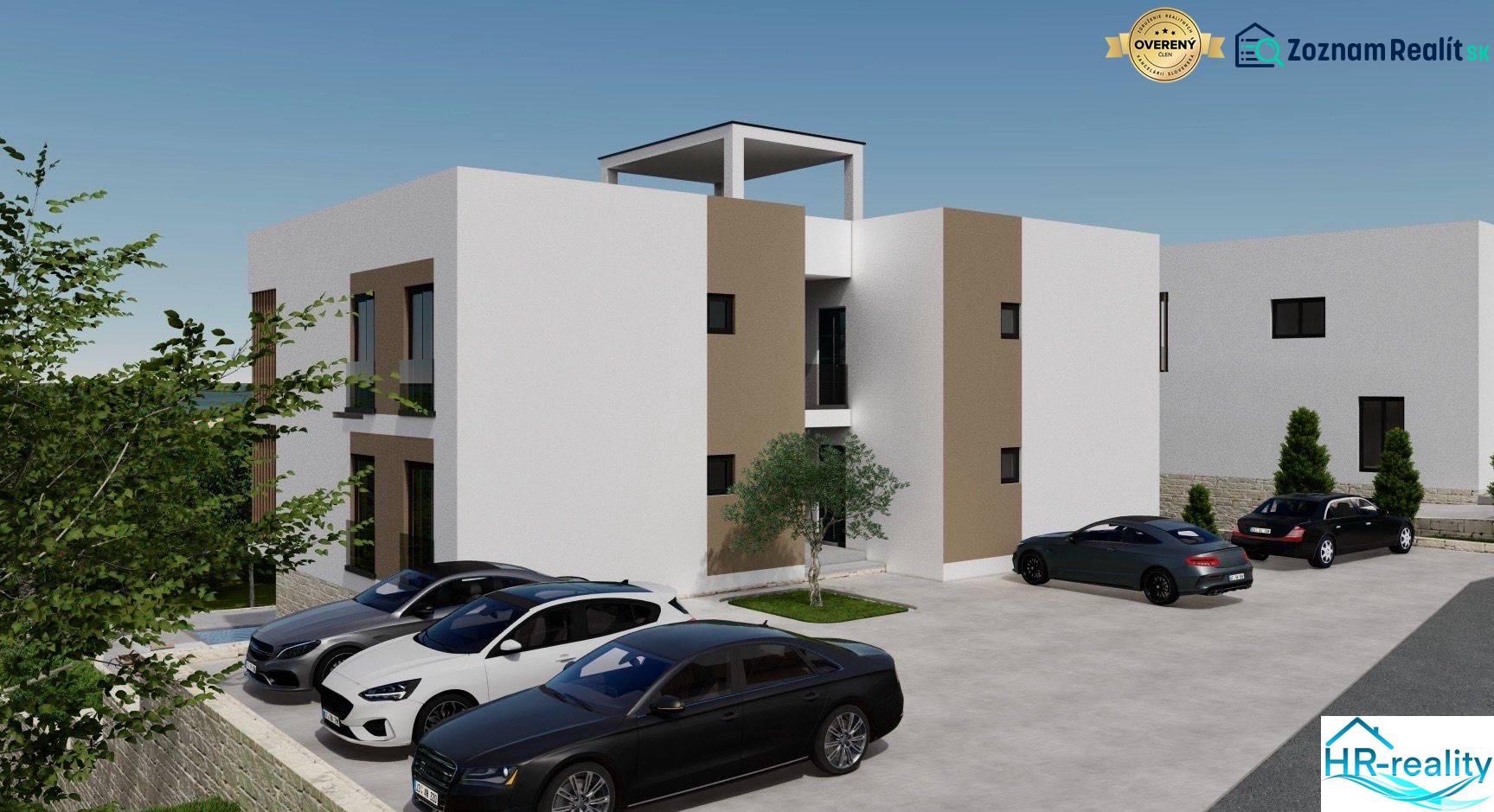 Recreational apartment in Ciovo with parked cars and surrounding greenery.