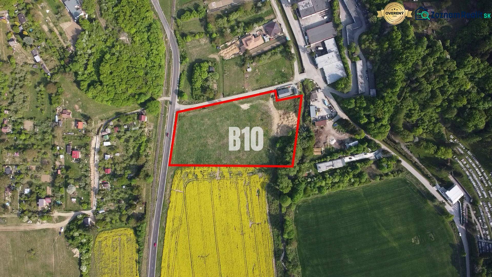 Aerial view of residential plots in Trenčianske Teplice surrounded by greenery.
