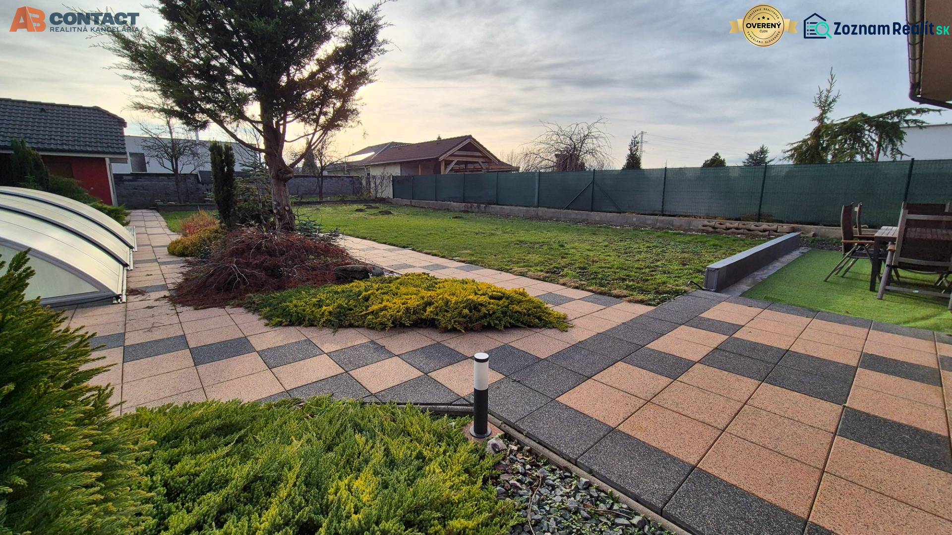 The garden at the family house on Veterná Street in Krakovany with paving and a terrace.
