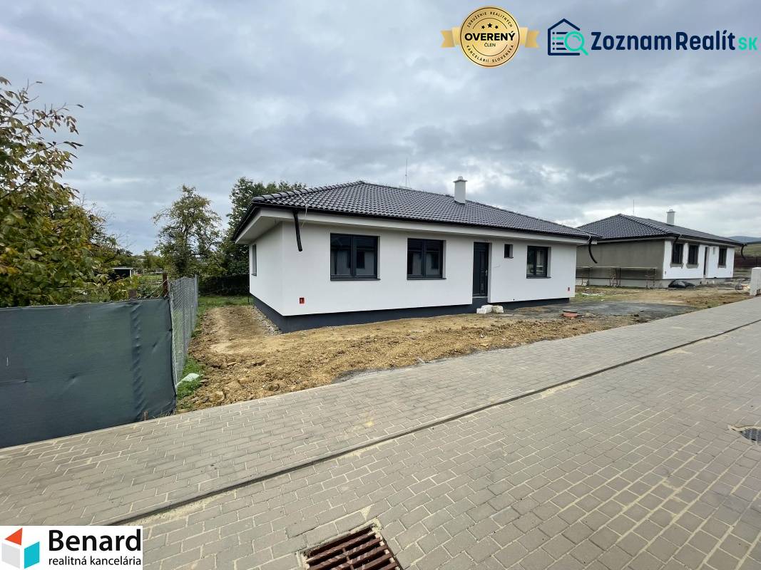 A family house in Soľ with a white facade and a dark roof.