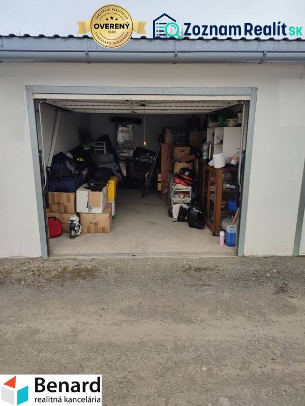 An open garage on Urxova Street in Prešov with various stored equipment and furniture.