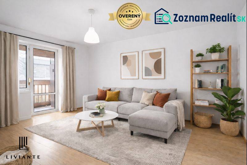 Studio apartment with a sofa, decorative paintings, wood-patterned flooring, and a balcony.