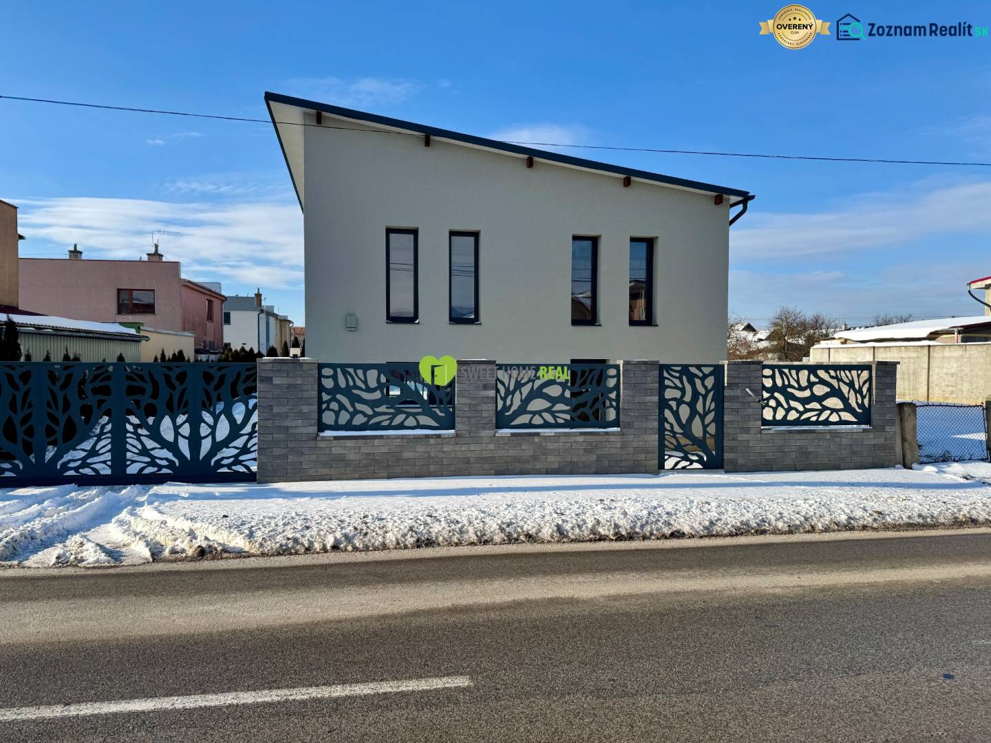 A family house on Gyňovská Street in Čaňa with an interesting fence and a snowy surroundings.