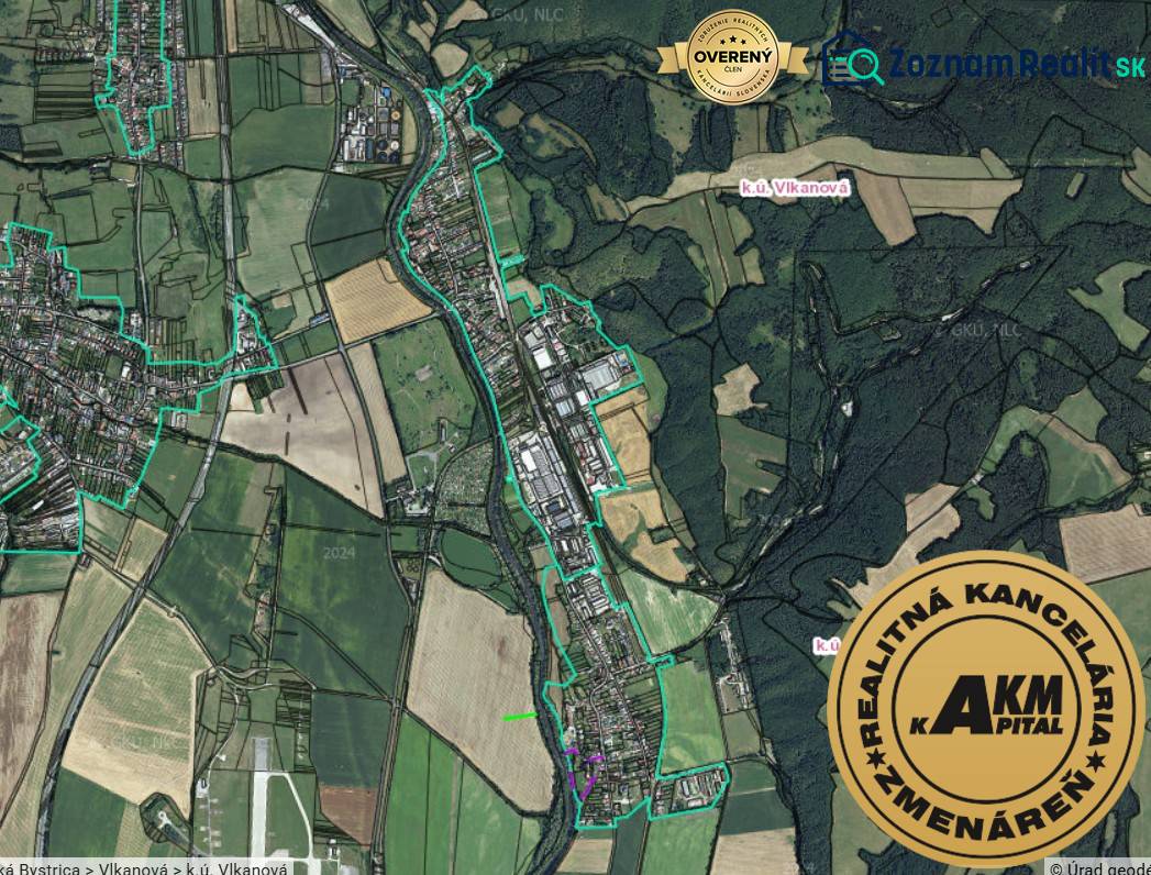 An aerial view of agricultural and forest lands around Badín.