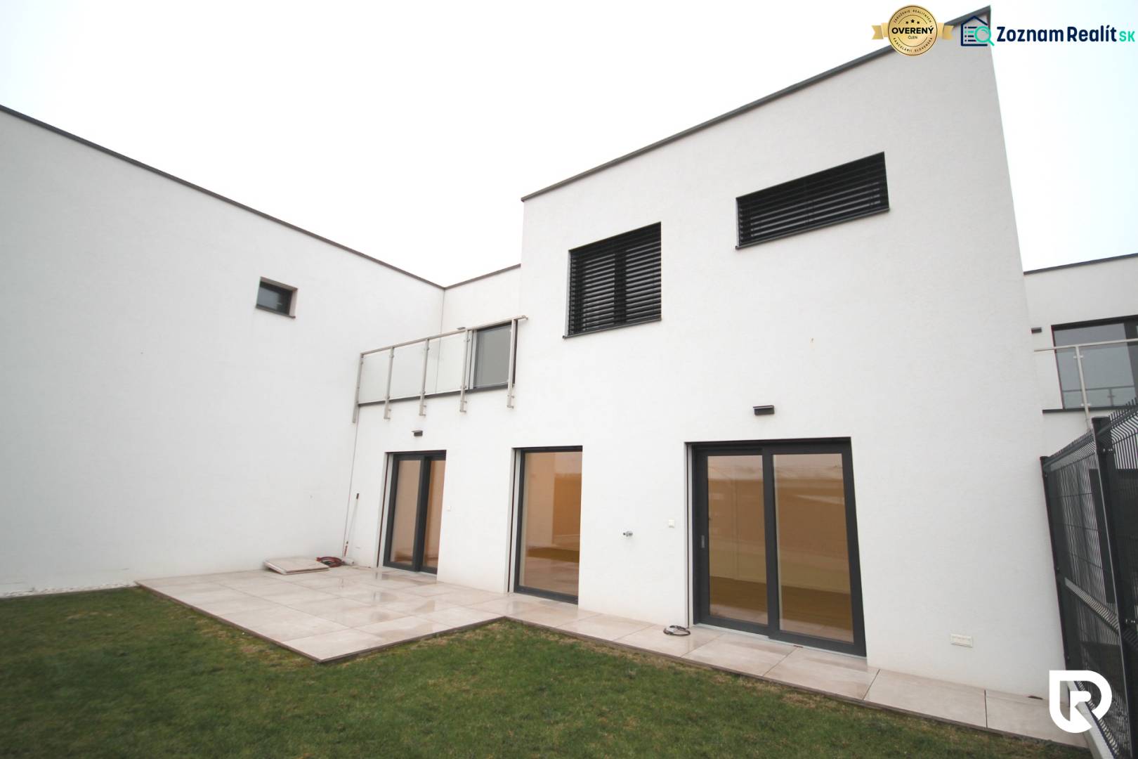 A family house on Legionárska in Trenčín with a terrace and a grassy garden.