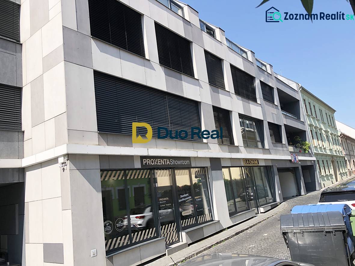 The building on Jozefská Street in Bratislava with showroom displays and offices.