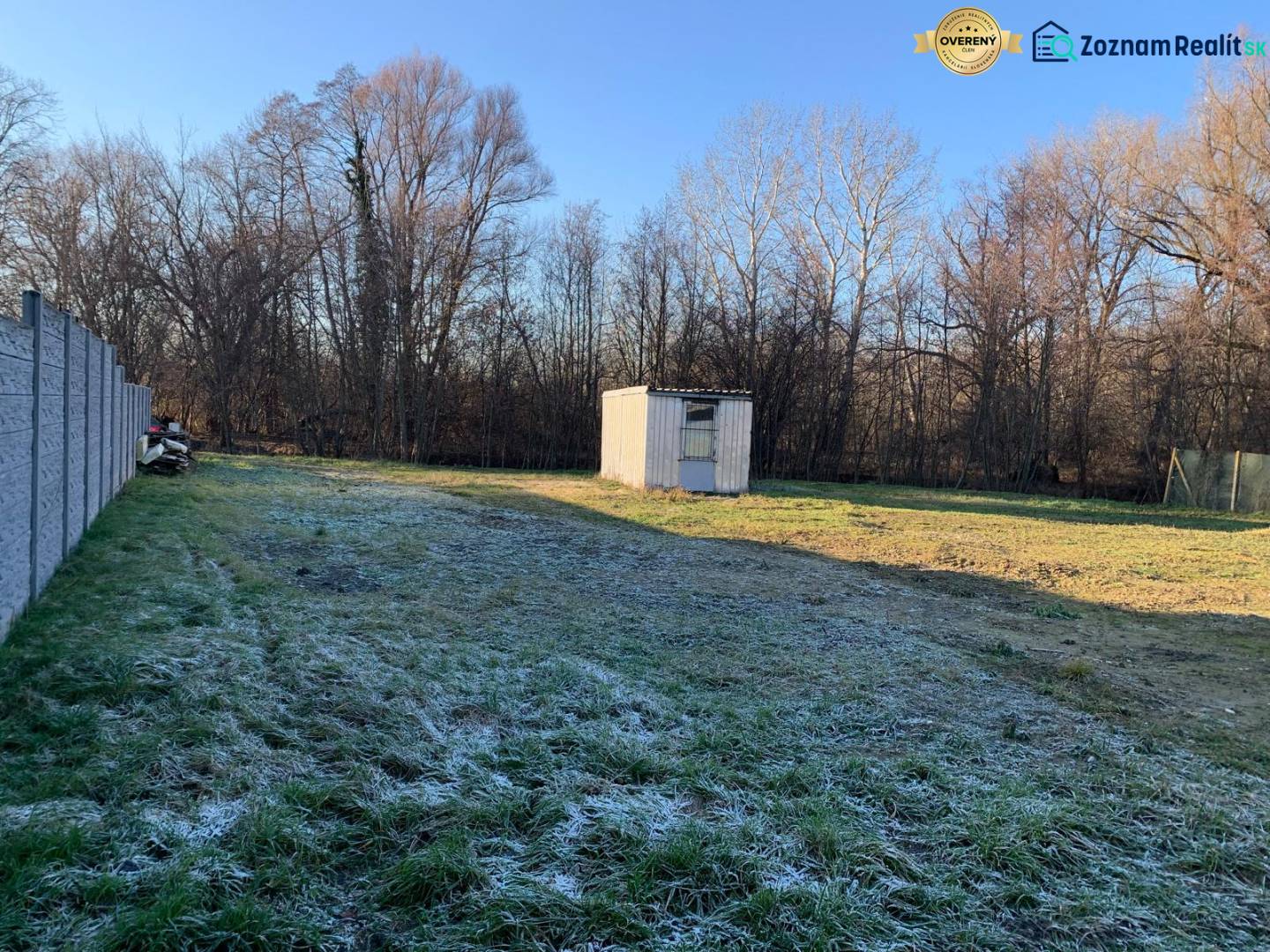 Fenced plot in Malé Leváre for living with a grassy area and a wooden shelter.