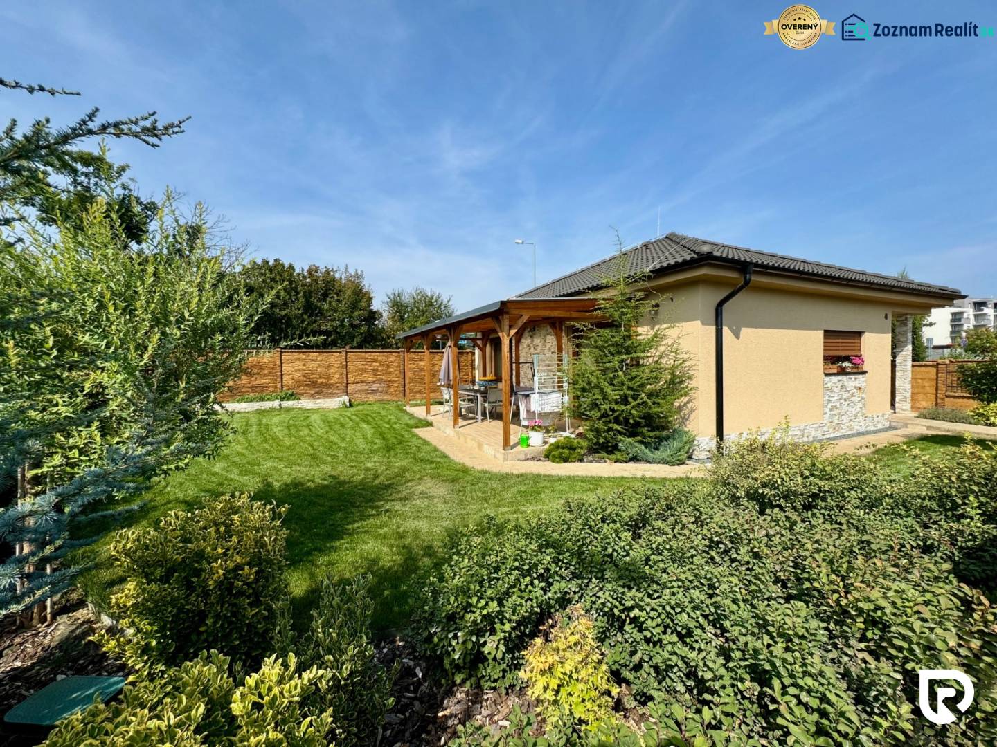 A family house on Pod privádzačom Street in Trenčín, surrounded by a landscaped garden and terrace.
