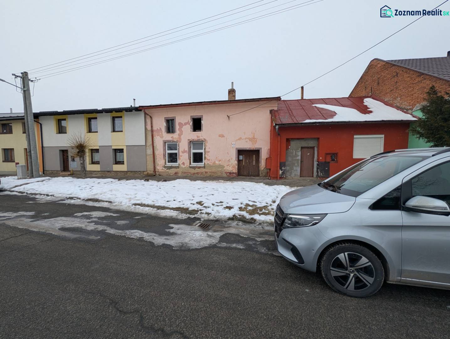 Family houses on Remeselnícka Street in Ľubica during the winter season with a snow cover.