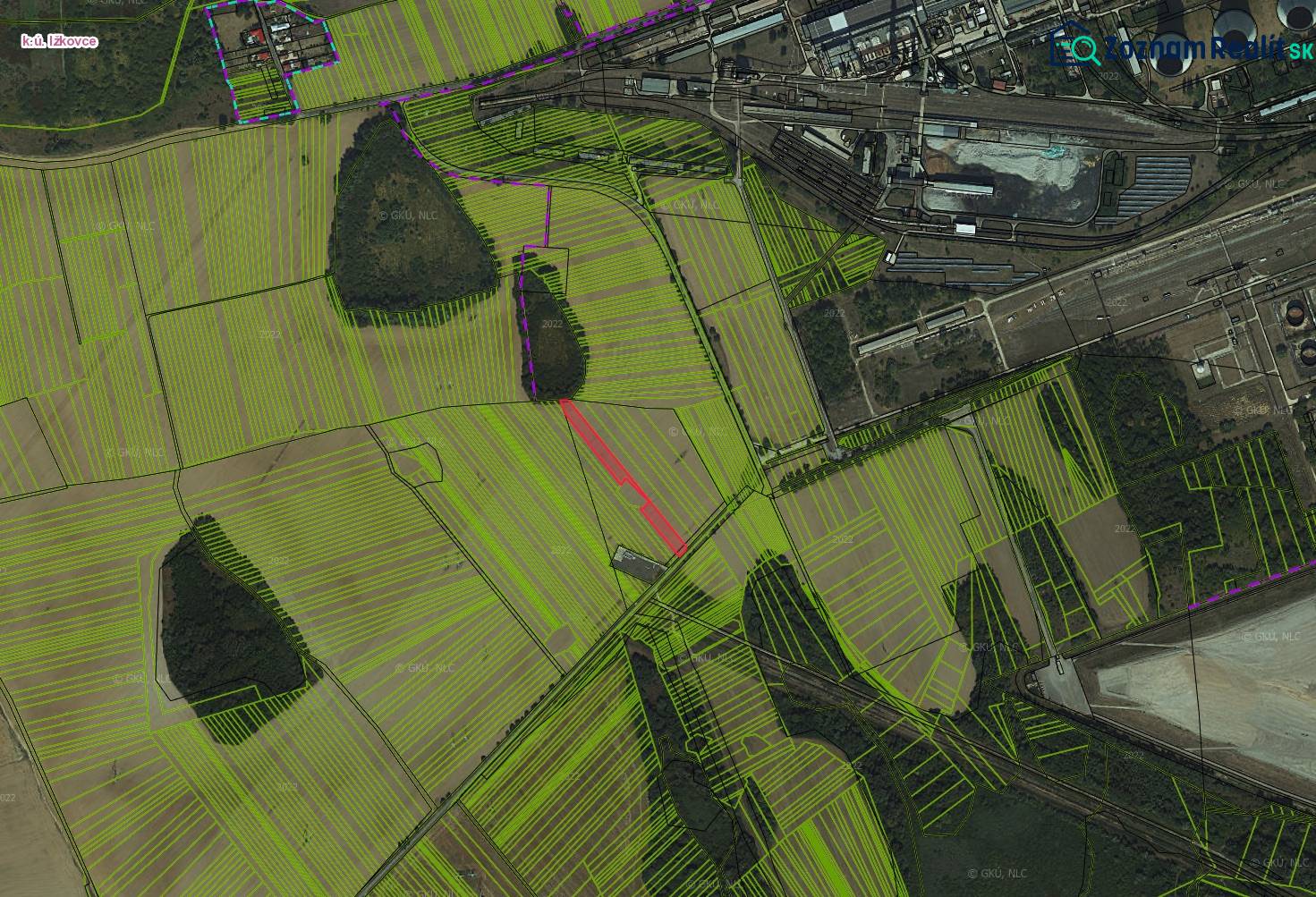 Aerial view of agricultural and forest land around Ižkovce.