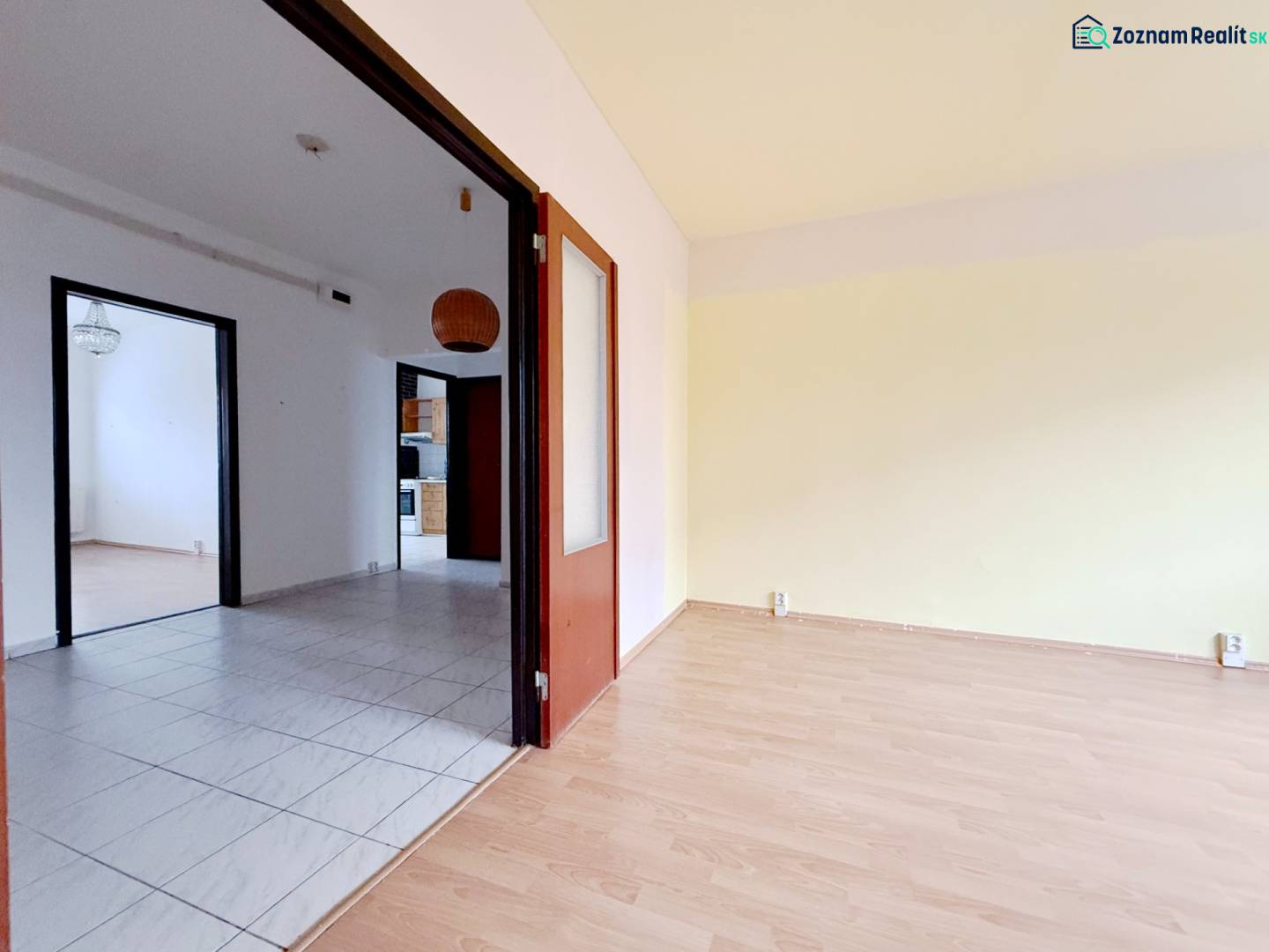 4-room apartment with wooden decor flooring and tiles in living areas.