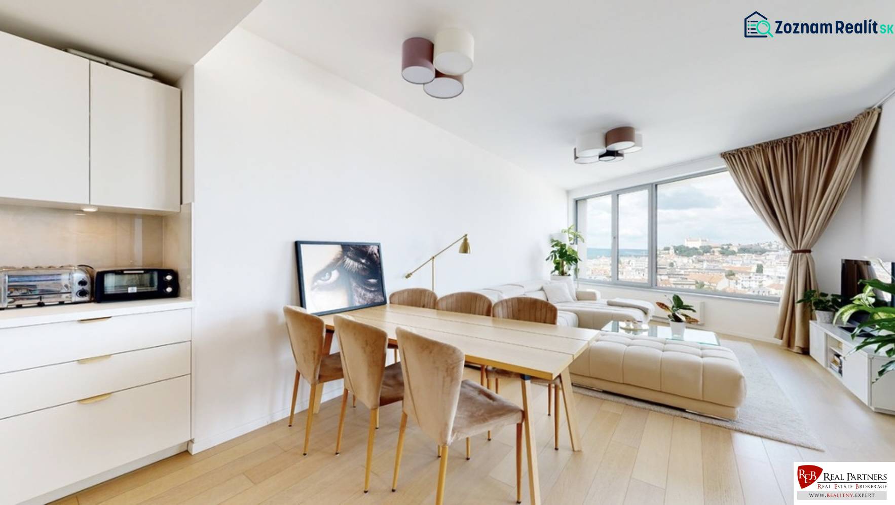 A bright living room with a dining table, a white sofa, and a view, 3-room apartment.