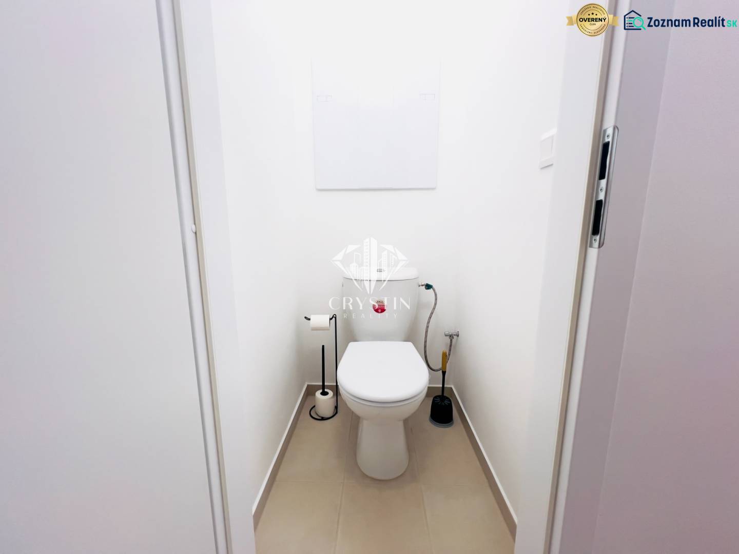 A bathroom with white walls in a two-room apartment, simple sanitary equipment.