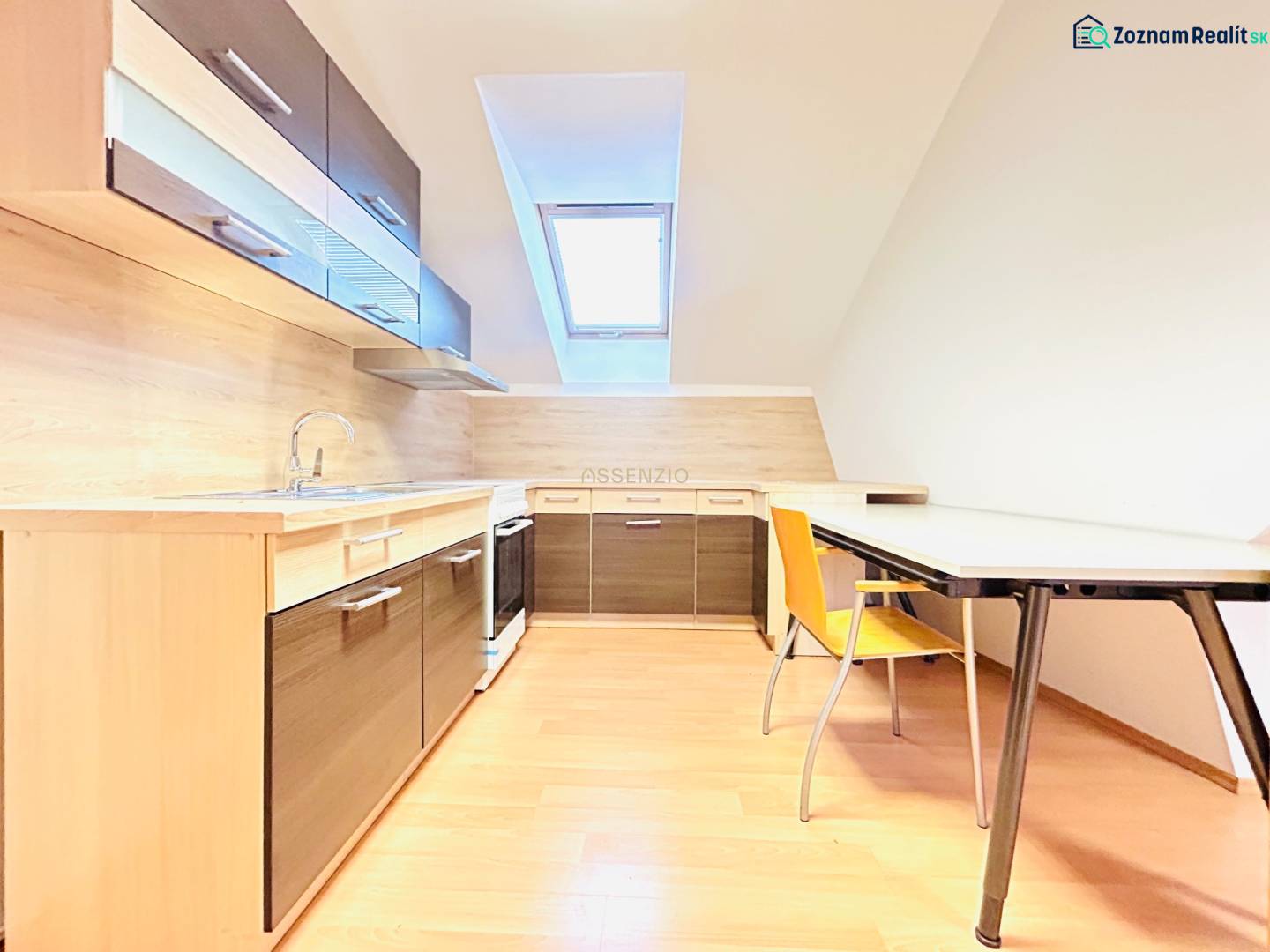 Offices with a kitchen and dining table, light floor with wood decor.