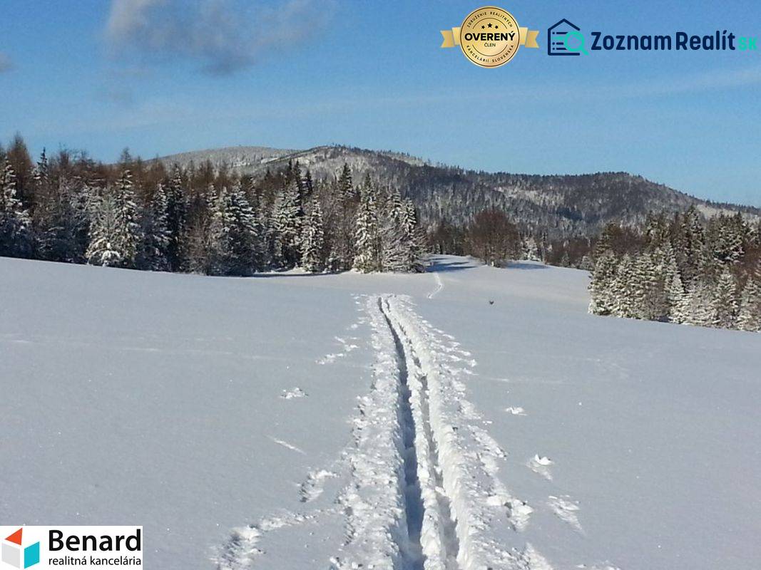 Recreational lands near Litmanová covered with snow, surrounded by snowy trees and hills.