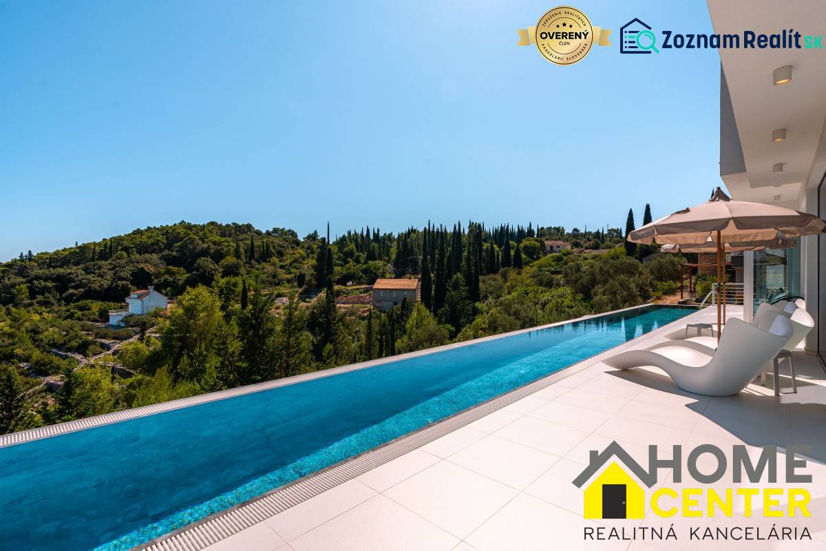 A pool at a villa in the town of Korčula with a view of the surrounding nature.