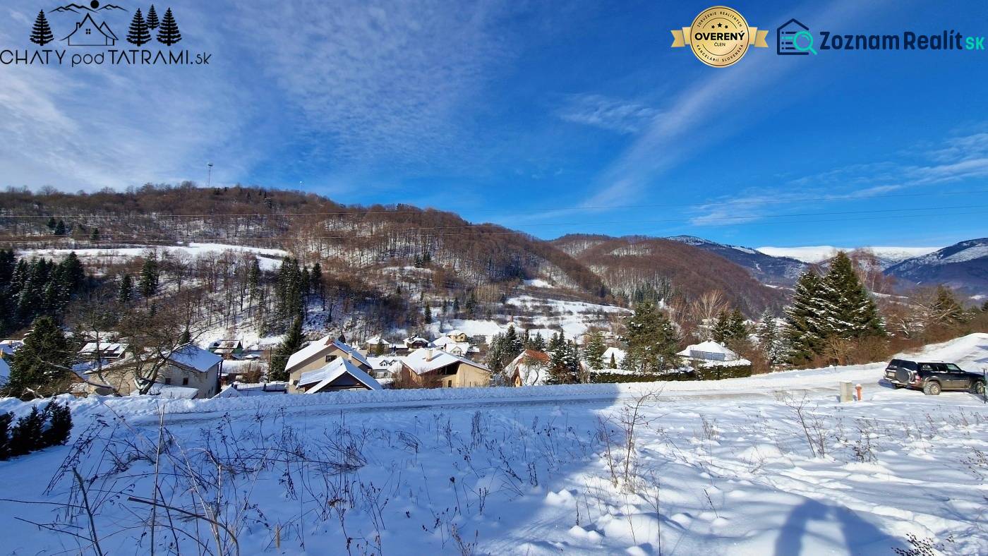 Snowy landscape in Mýto pod Ďumbierom with a view of residential plots.