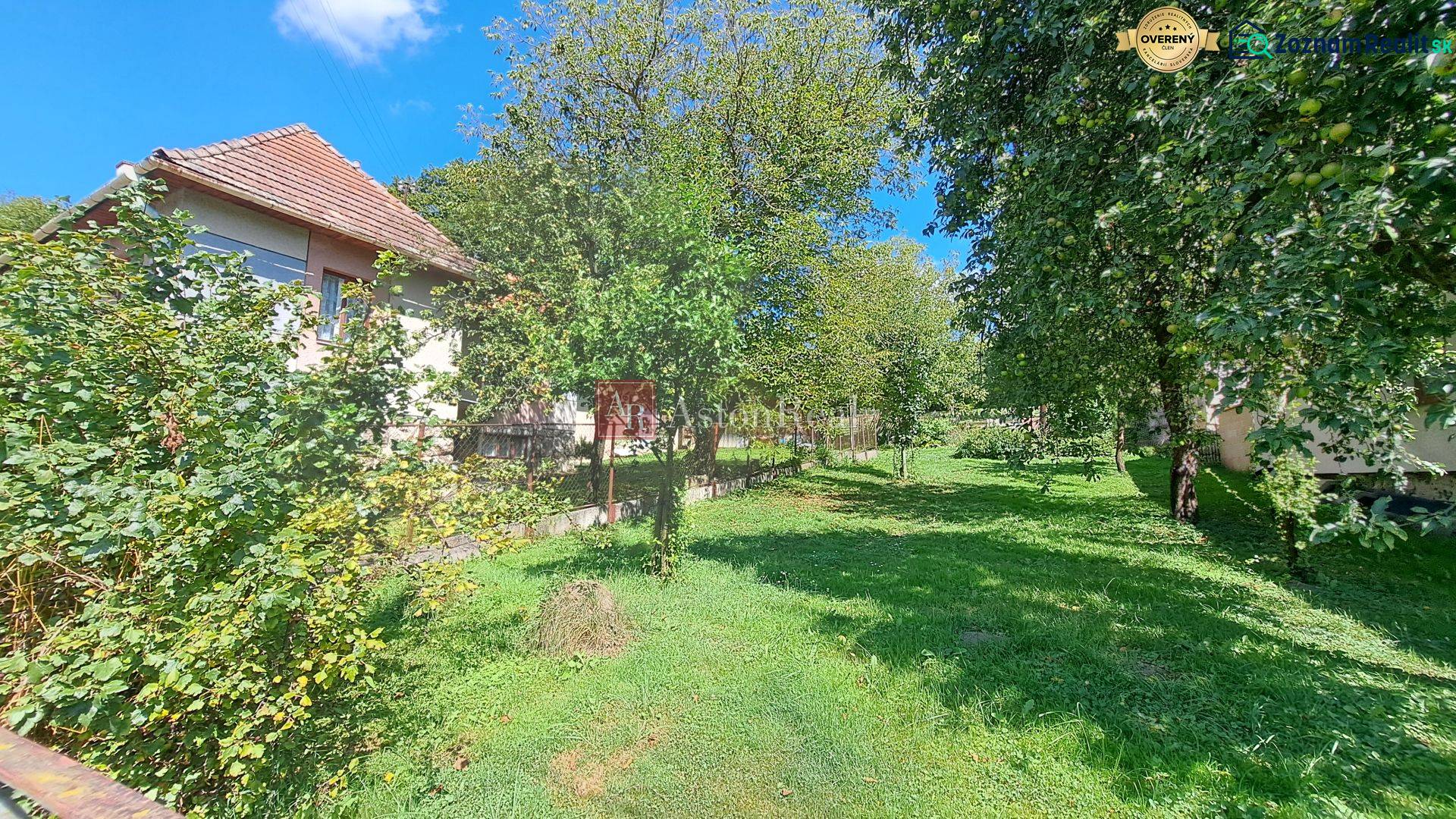 A family house in the village of Kalameny in Ružomberok, surrounded by greenery and fruit trees.