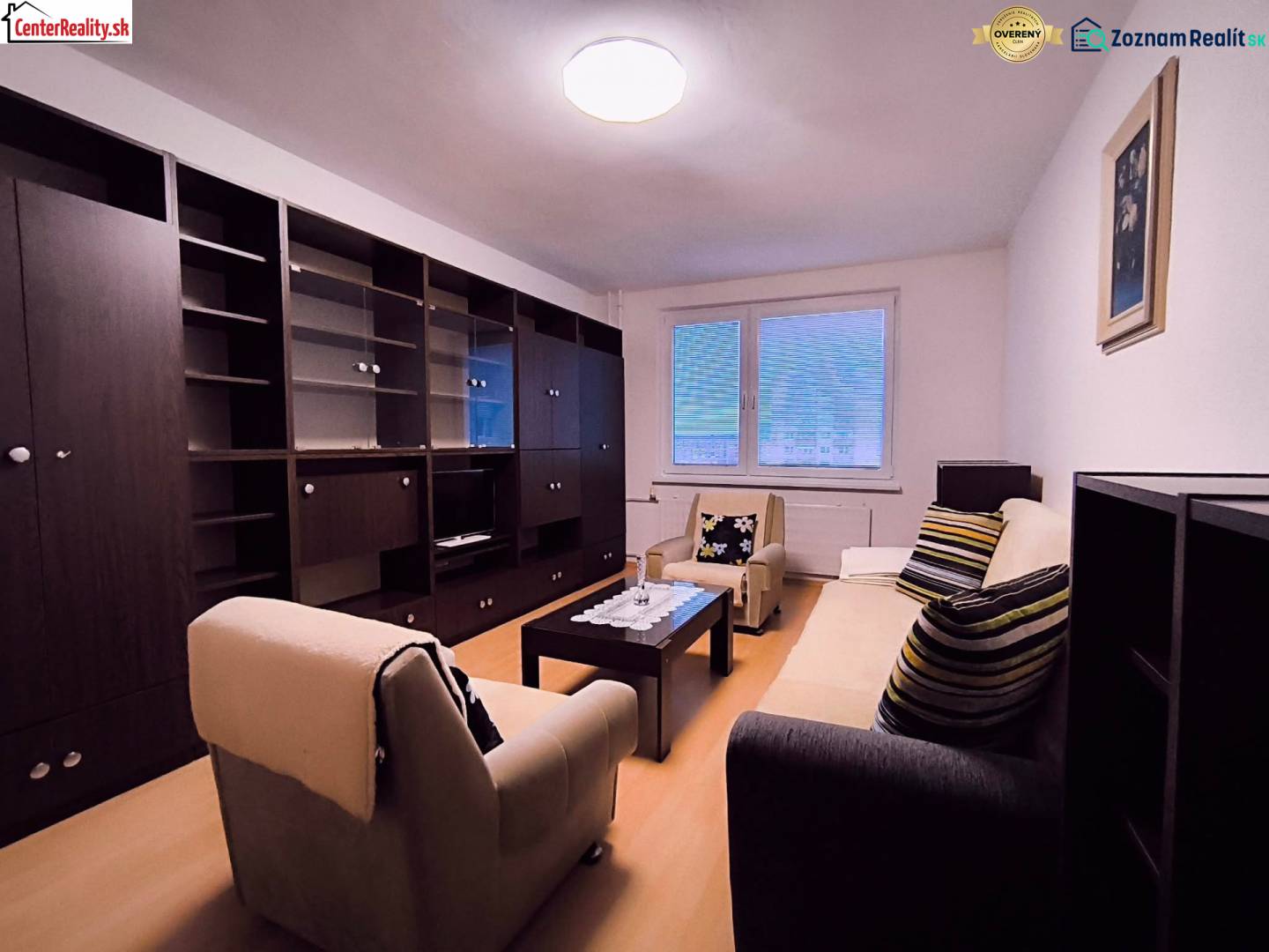 Living room with a sofa, armchairs, a coffee table, and a set in a 2-room apartment.