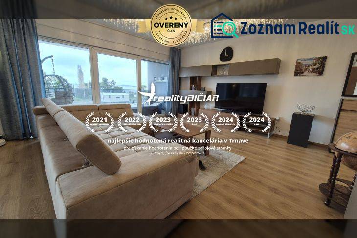 Living room in a Holiday Apartment with a sofa and wooden decor flooring.