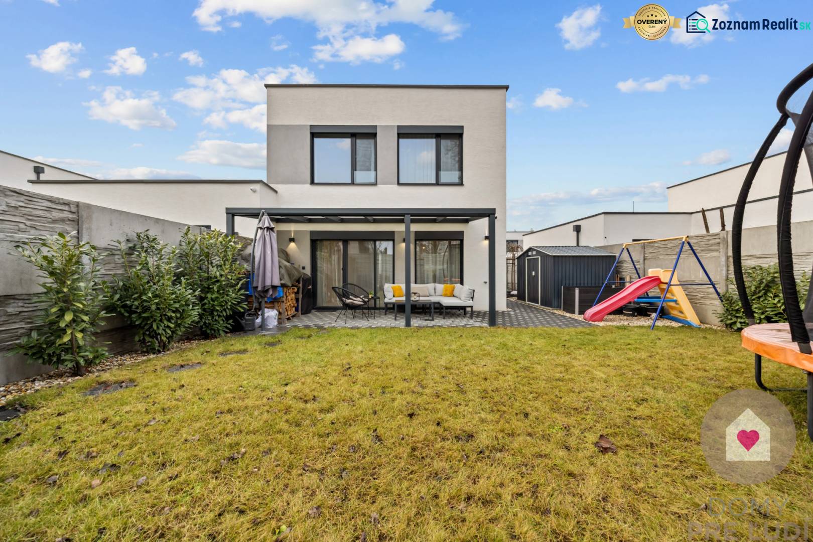 Garden of a 4-room apartment on Topoľová Street in Rovinka with a lawn and a children's playground.