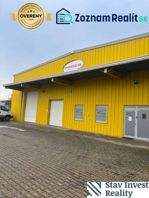 Yellow warehouse and hall building on Poľná cesta in Senec with entrance gates.