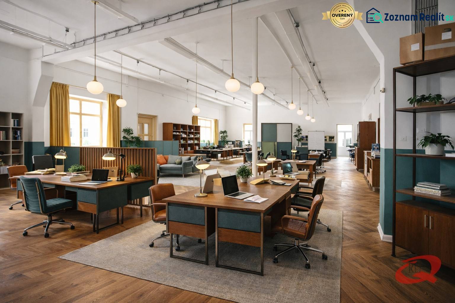 Interior of a building with office desks, chairs, wood-patterned flooring, and lighting.