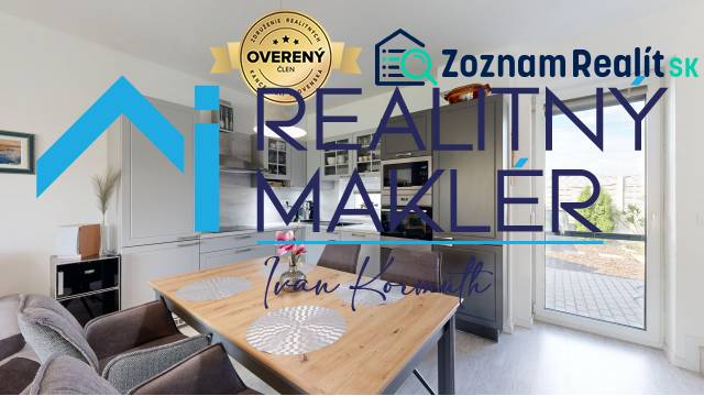 A kitchen in a family house with a dining table and access to the terrace.