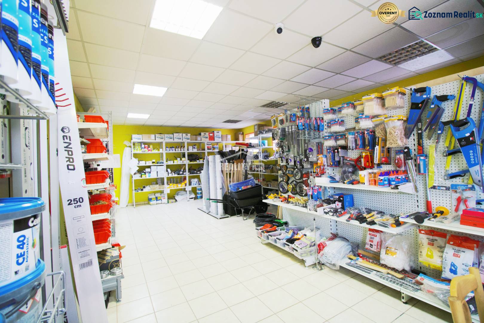 Interior of a workshop with shelves full of building materials and tools.