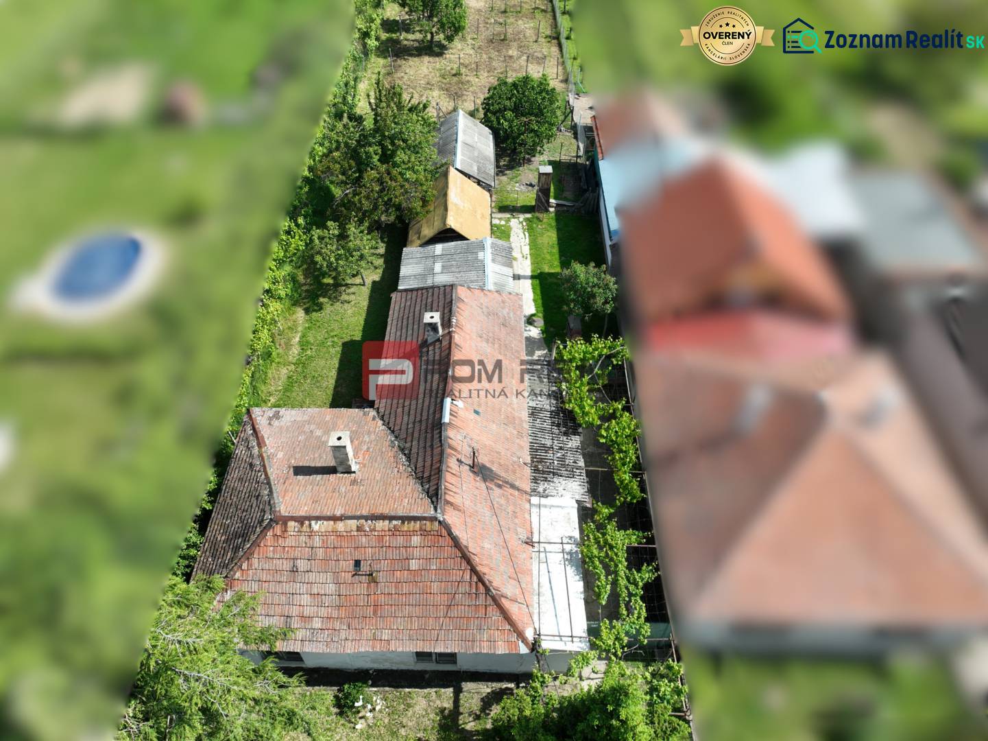 Aerial view of a plot with a family house in the town of Dolné Orešany surrounded by a garden.