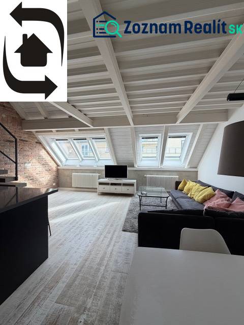 Attic living room with skylights, wooden decor flooring, 4-room apartment.