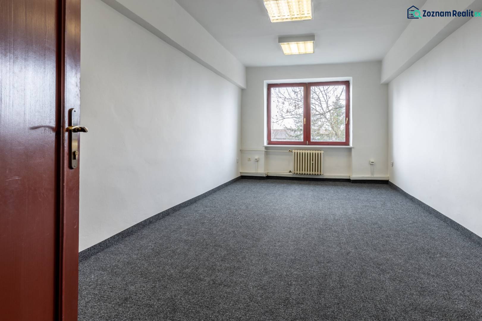 Empty office with carpet, white walls, and a window, Offices.