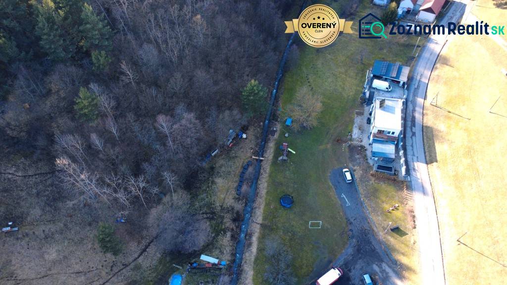 Aerial view of Župkova Recreational Grounds with buildings, trees, and a road.