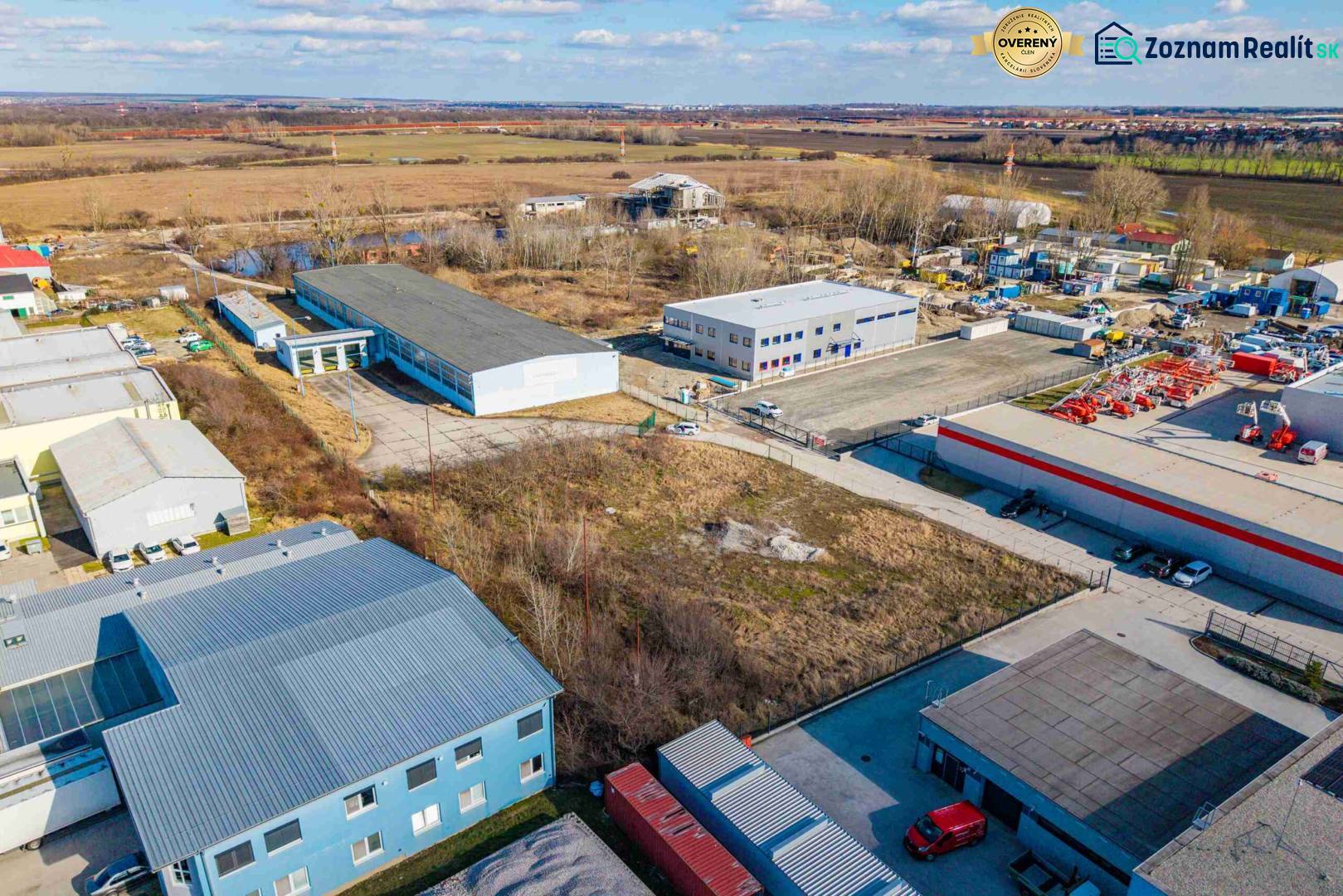 Aerial view of commercial land in Bratislava - Vajnory with buildings and open space.