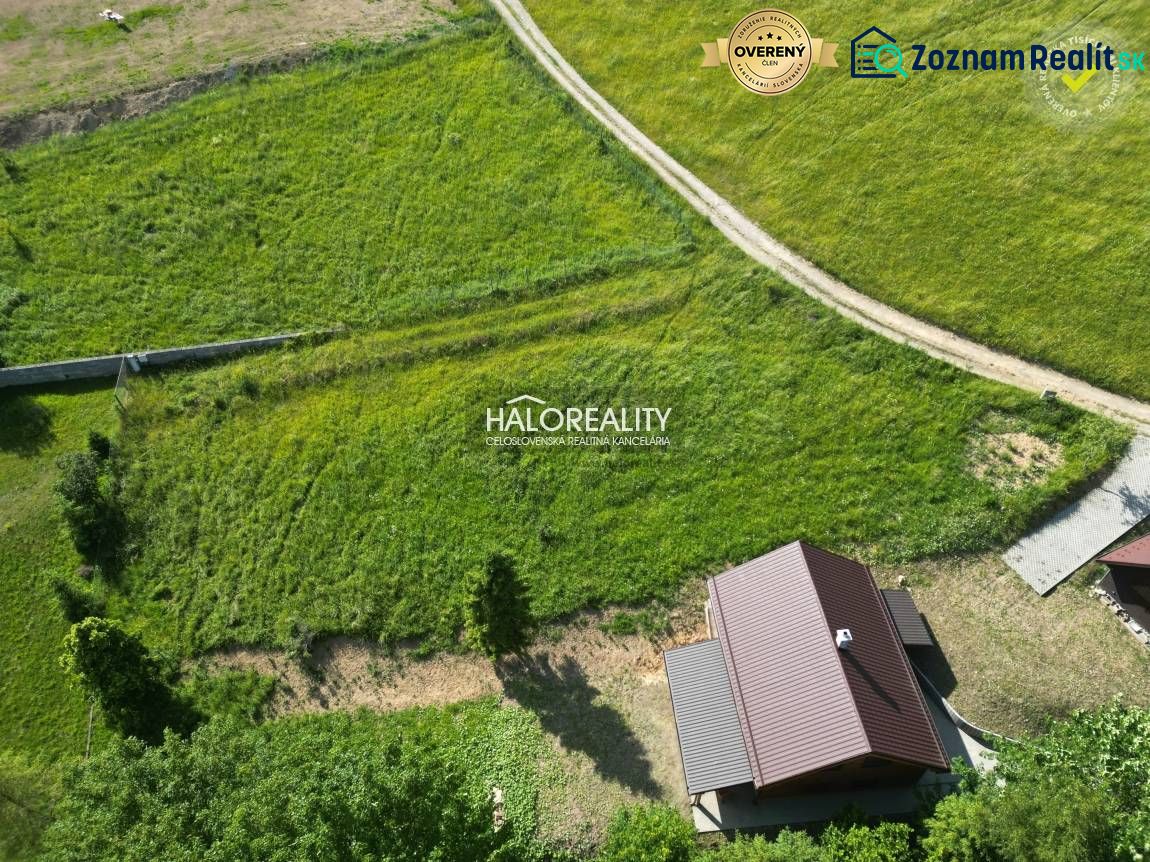 Aerial view of Recreational plots in Vyšné Ružbachy with green meadows and a house.