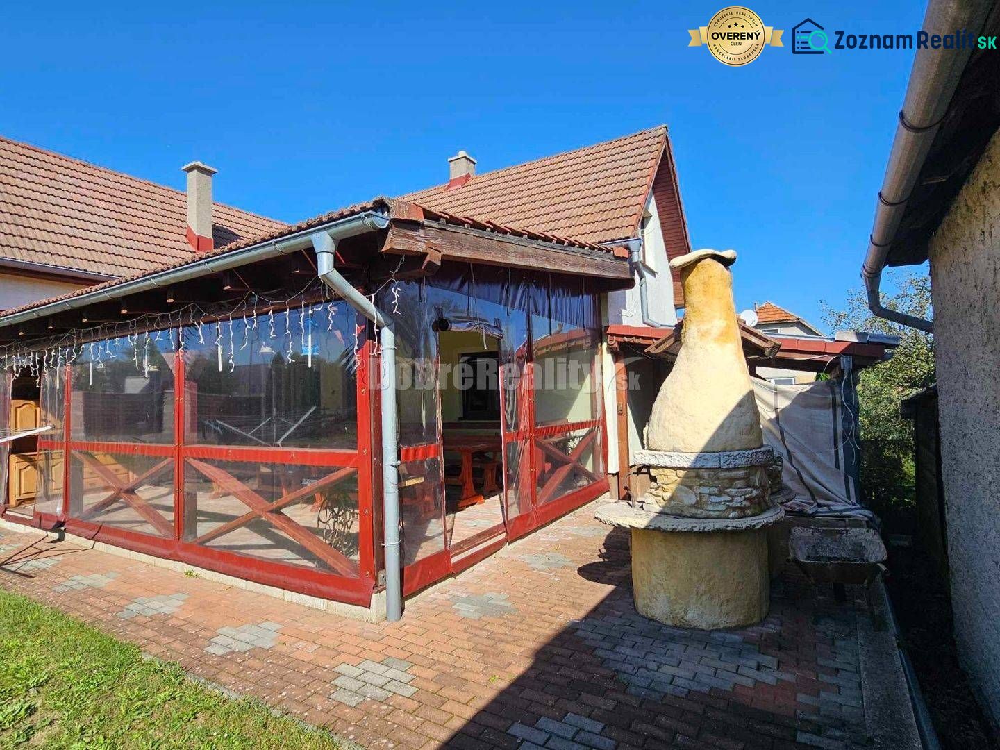 Terrace of a family house in Malá Lehota with a grill and paved surroundings.