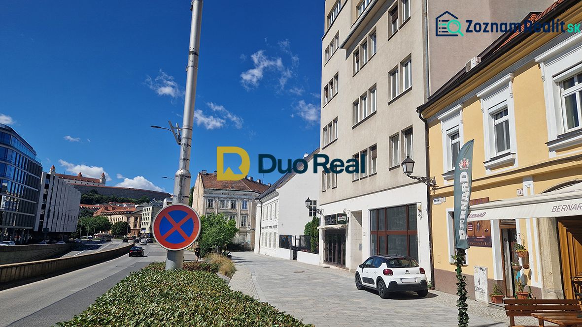 Konventná Street in Bratislava - Old Town, commercial spaces and traffic sign.