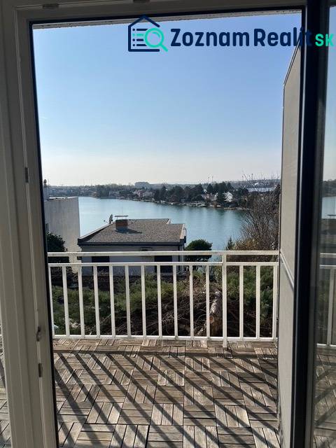 View from the cottage at Sunny Lakes in Senec with wooden floor decor.