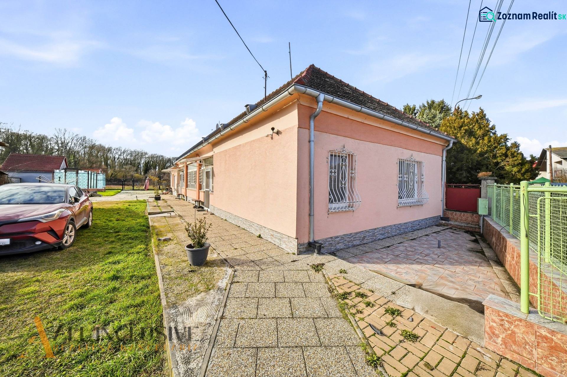 A family house in Vrakúňa, suitable for residential plots, with a landscaped yard.