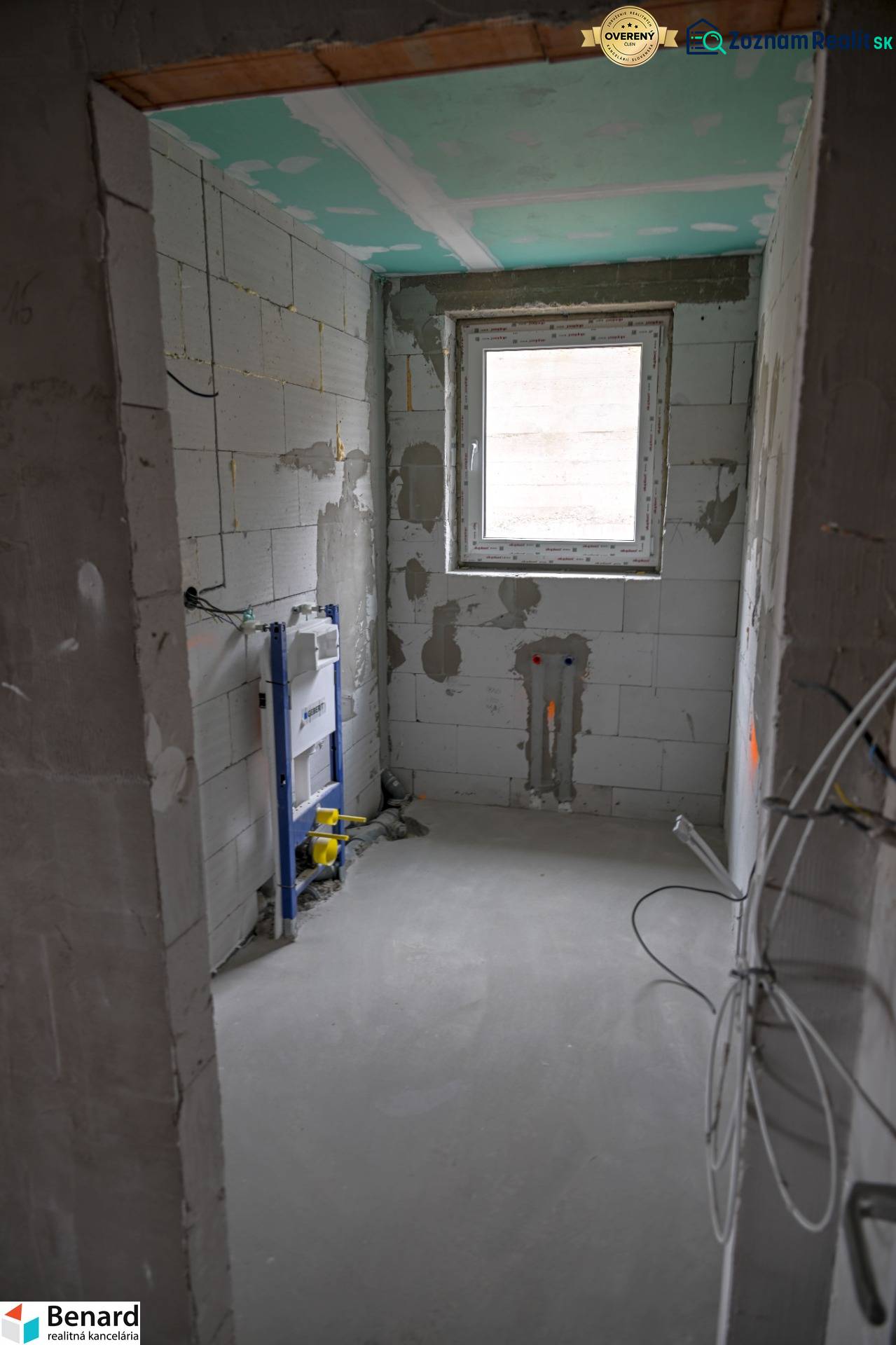 Bathroom construction in a 3-room apartment with toilet installation and a window.