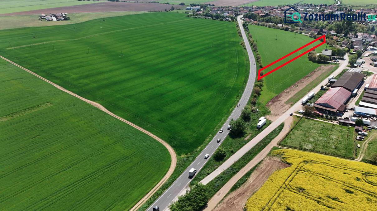 Aerial view of green fields around Družstevná Street, Blatné, Land - residential.