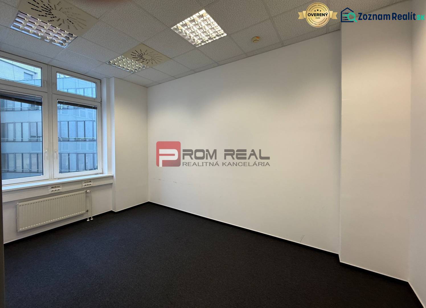 Offices with carpeted floors and large windows.